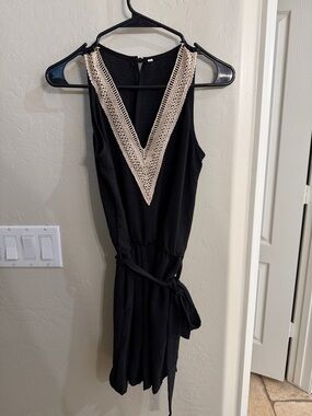 Amazon Black Sleeveless V-Neck Romper with Cream Crochet Trim